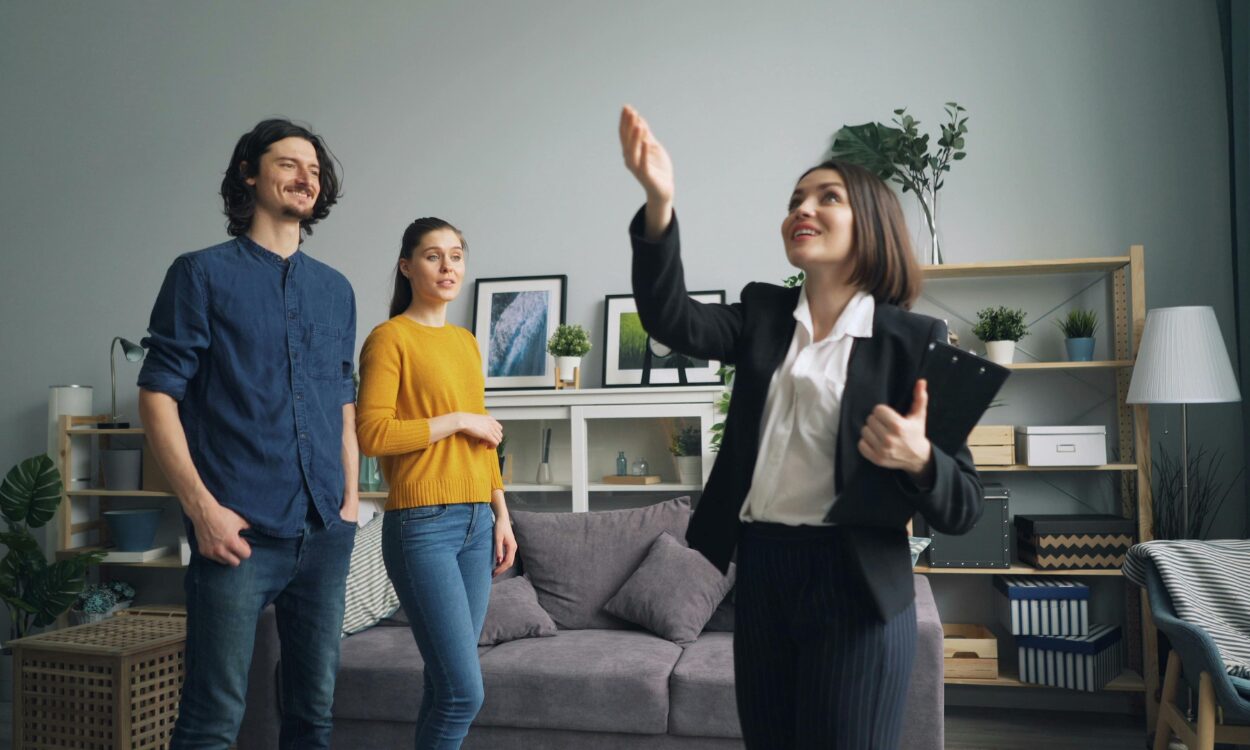 Estate agent showing a rental property to a couple during a viewing, representing landlord and homeowner guidance in Lovelle’s 2025 Budget update.