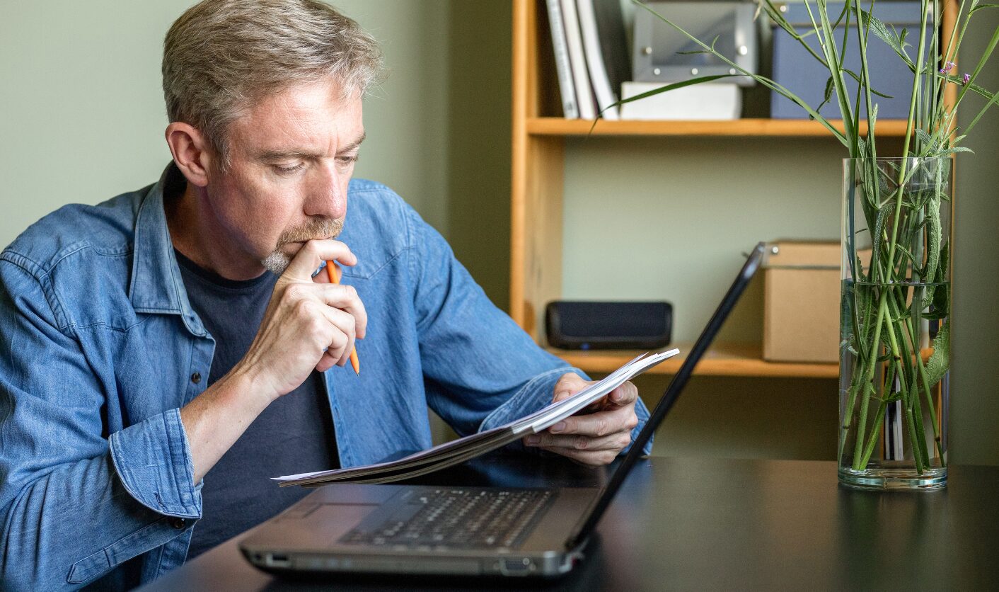 Landlord reviewing tenant documents and affordability checks at home